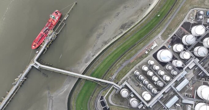 Tank terminal of Terneuzen, Bulk energy and chemical products are stored in these terminals. multimodal transport of sea and land. Fuels and energy products. Storage cotnainers and a ship docked for