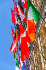 Fototapeten European countries flags on facade of Antwerp City Hall Stadhuis Antwerpen building in Antwerp city historical centre, vertical view, Flemish Region, Belgium © Aliaksandr