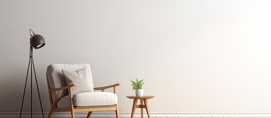 In a room, there is a white chair placed beside a table that has a lamp on top of it