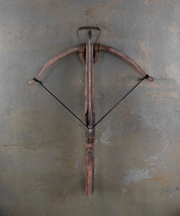 medieval wooden crossbow on a gray background