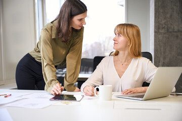 Corporate colleagues discussing business ideas of clothing design