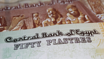 Closeup of old currency Egypt pound and piastres banknotes with lettering of central bank
