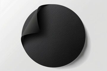 Minimalist black circle with curled corner on white wall. Suitable for interior design concepts