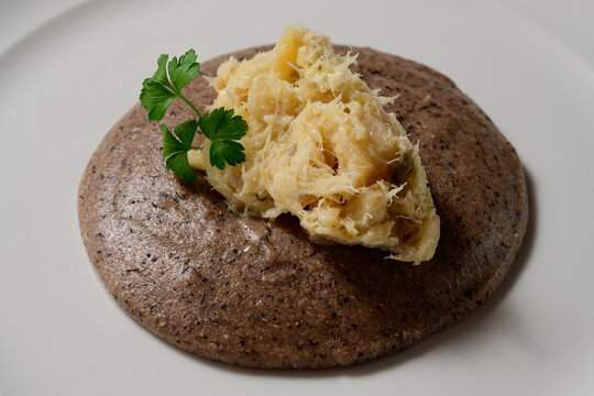 Baccala alla Vicentina with Black Polenta Nera Close Up Venetian Stockfish from Vicenza