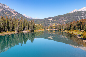 Reflections on the Bow River in the mountains