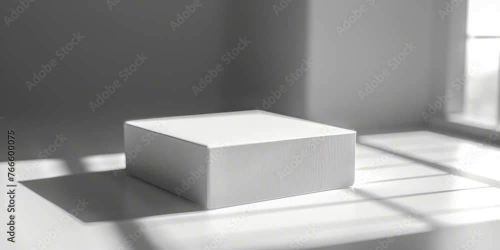 Aufkleber A white box placed in front of a window, suitable for various design projects