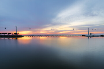 Fototapeta na wymiar Parque das Nacoes (Park of Nations) at sunrise. Tagus river bank, Lisbon, Portugal.