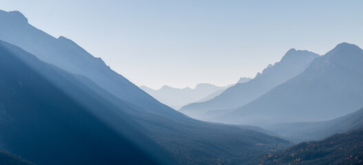 Hazy view down Spray Valley in Banff National Park