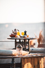 Luxury Exotic Delicious Breakfast Al Fresco - Outdoors on a terrace at sunrise overlooking Goreme,...
