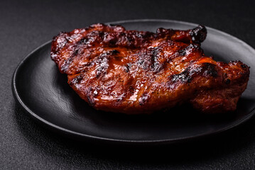 Fresh juicy delicious beef steak on a dark background