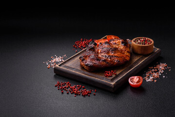Fresh juicy delicious beef steak on a dark background