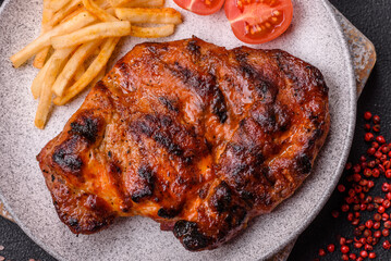 Fresh juicy delicious beef steak on a dark background