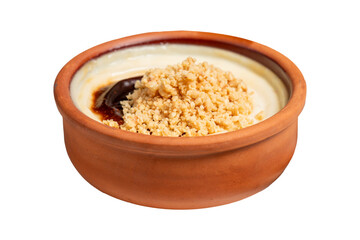 Rice pudding isolated on white background. Milky dessert. Oven-baked rice pudding dessert in a clay...