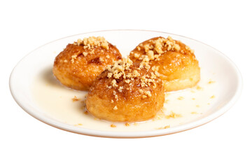 Kemalpasa dessert isolated on white background. Milky dessert. Dessert with hazelnuts, milk and sherbet. Close up
