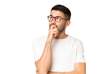 Young handsome caucasian man over isolated chroma key background having doubts and with confuse face expression