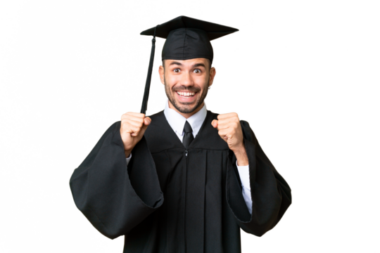 Young university graduate man over isolated chroma key background celebrating a victory in winner position