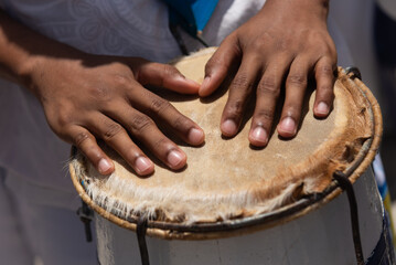 Percussionist hands playing atabaque. African music.