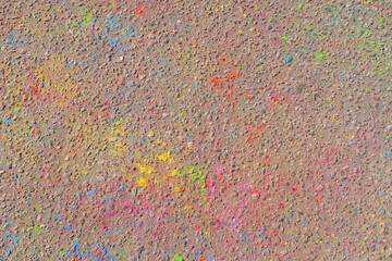 Directly above on explosion of multicolor holi powder on asphalt background - 766620453