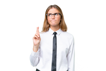 Young business caucasian woman over isolated background with fingers crossing and wishing the best