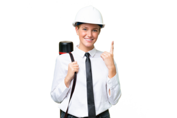 Young architect caucasian woman with helmet and holding blueprints over isolated background pointing with the index finger a great idea