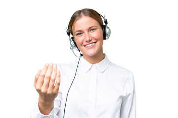 Telemarketer caucasian woman working with a headset over isolated background inviting to come with hand. Happy that you came