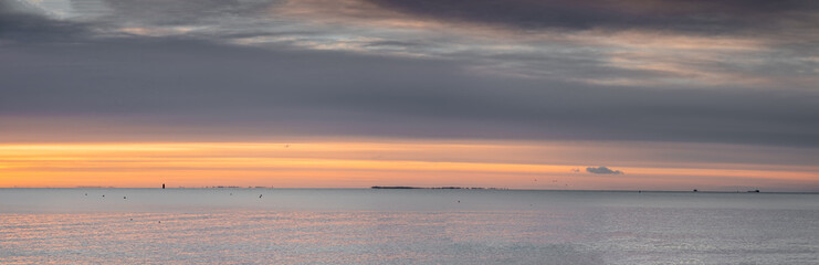 beautiful seascape with clouds over the sea, natural minimalistic background and texture, panoramic view banner. pastels tones