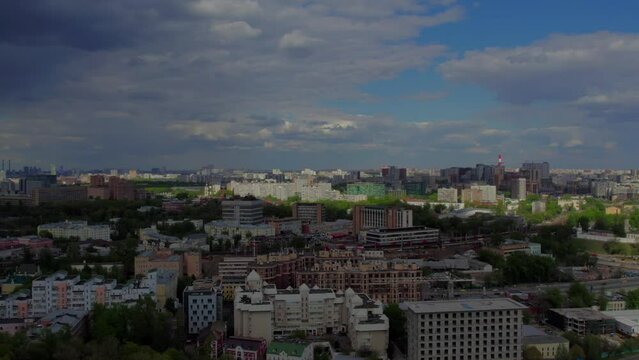 A captivating aerial view of Moscow's bustling city center and its picturesque surroundings, captured gracefully by a drone. The footage showcases iconic landmarks and urban landscapes