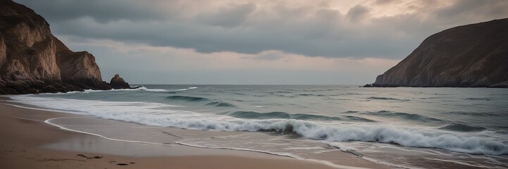 Fototapeta premium Beach and Sea Landscape: A Tranquil Scene of Sandy Shores Meeting Gentle Waves