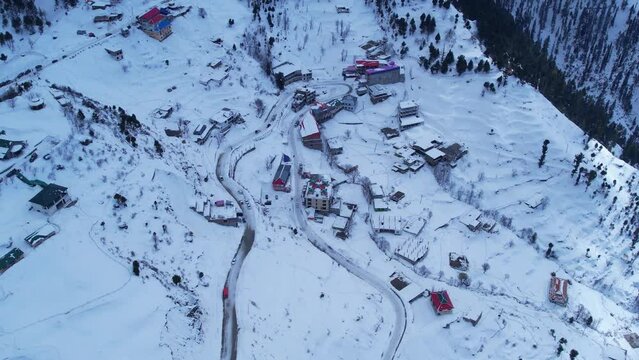 Aerial view of Malam Jabba hill station and Himalayan mountains covered in snow during winter in Swat Khyber Pakhtunkhwa Pakistan