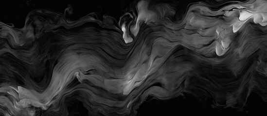 An image focusing closely on a black and white photo displaying a captivating swirl formed by a...
