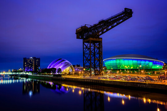 The redeveloped docklands area of Glasgow at night, with the Clyde Auditorium, the Hydro and Finnieston Crane.