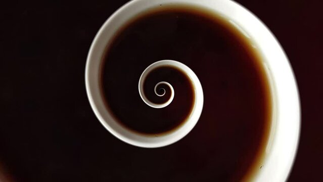 Animated cup of coffee or tea swirl frame. Abstract seamless swirl cup loop 4K border.  A cup with a drink twisted into an endless spiral. Backdrop for club, show, music video, presentation, office
