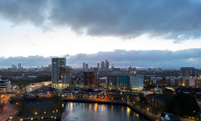 Fototapeta premium The Sunrises over Deansgate Square, a residential skyscraper cluster on the southern edge of Manchester City Centre, UK They are called, North, West, South ,East, The Blade, Beetham Tower and Three60.