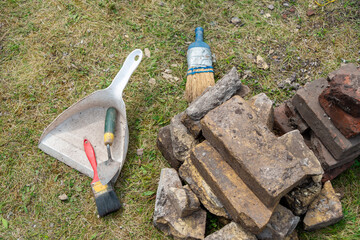 Archaeology dig tools for removing dirt and debris at a burial site. The soft bristled brushes,...