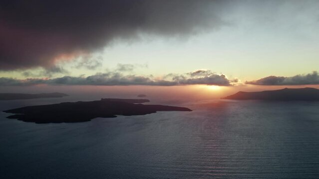 Dramatic Greek sunset from a drone depicting islands and Aegean sea in Santorini
