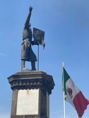 Benito Juárez Statue and mexican flag in the Main Square in Cholula, Puebla.