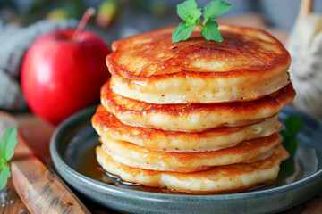 Delicious pancake breakfast with syrup, fresh apple - obrazy, fototapety, plakaty