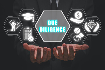 Due diligence concept, Businessman hands holding due diligence icon on cirtual screen.