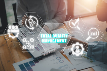 Total quality management concept, Business team analyzing income charts and graphs on office desk...