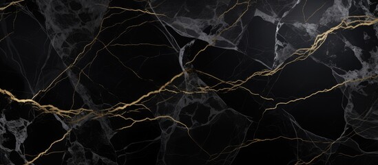 Black marble surface featuring elegant gold lines running across the unique veining pattern