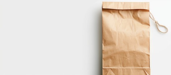 A brown kraft paper bag is shown in a mockup collection against a white background, ready for packaging designs. The image includes a clipping path for easy editing.