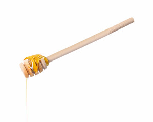 Fresh honey dripping from dipper on white background