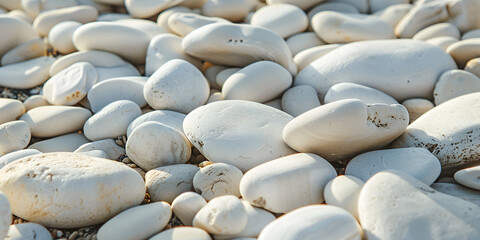 Fototapeta na wymiar Texture of white sea stones close-up, round smooth stones for design, background