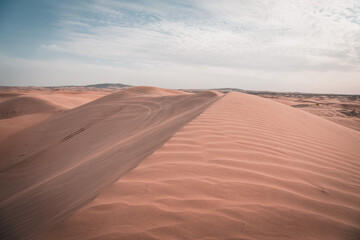 Fototapeta na wymiar Sunset over the sand dunes in the Gobi Desert in Inner Mongolia, China.
