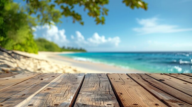 Top of wood table with blurred sea and coconut tree background