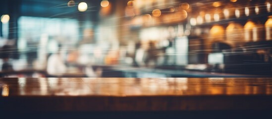 A city bar captured in a blurry image, featuring a wooden table in the foreground. An event display device rests on the table, showcasing a rectangular font