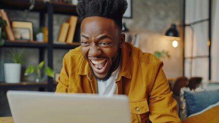 Obraz premium Happy excited man looking at laptop monitor screen. Background concept