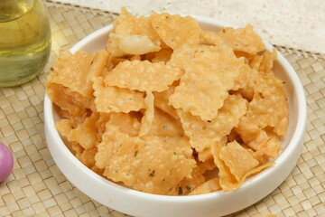 Keripik bawang, keripik pangsit or crispy fried dumpling, popular savoury snack in Indonesia,...