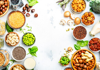 Vegan food background with empty space. Plant protein., vegetarian nutrition sources. Healthy eating, diet ingredients: legumes, beans, lentils, nuts, soy milk, tofu, cereals, seeds and sprouts