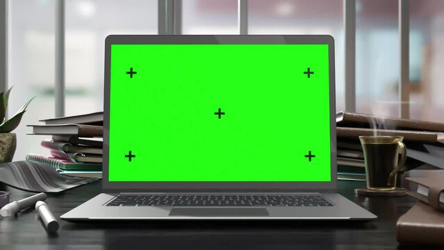 Laptop Mock-Up black color on work desk with green screen. Coffee Cup with natural steam smoke. 3D Render.	